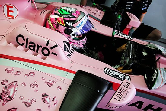 F1 car in pink colour in the box.