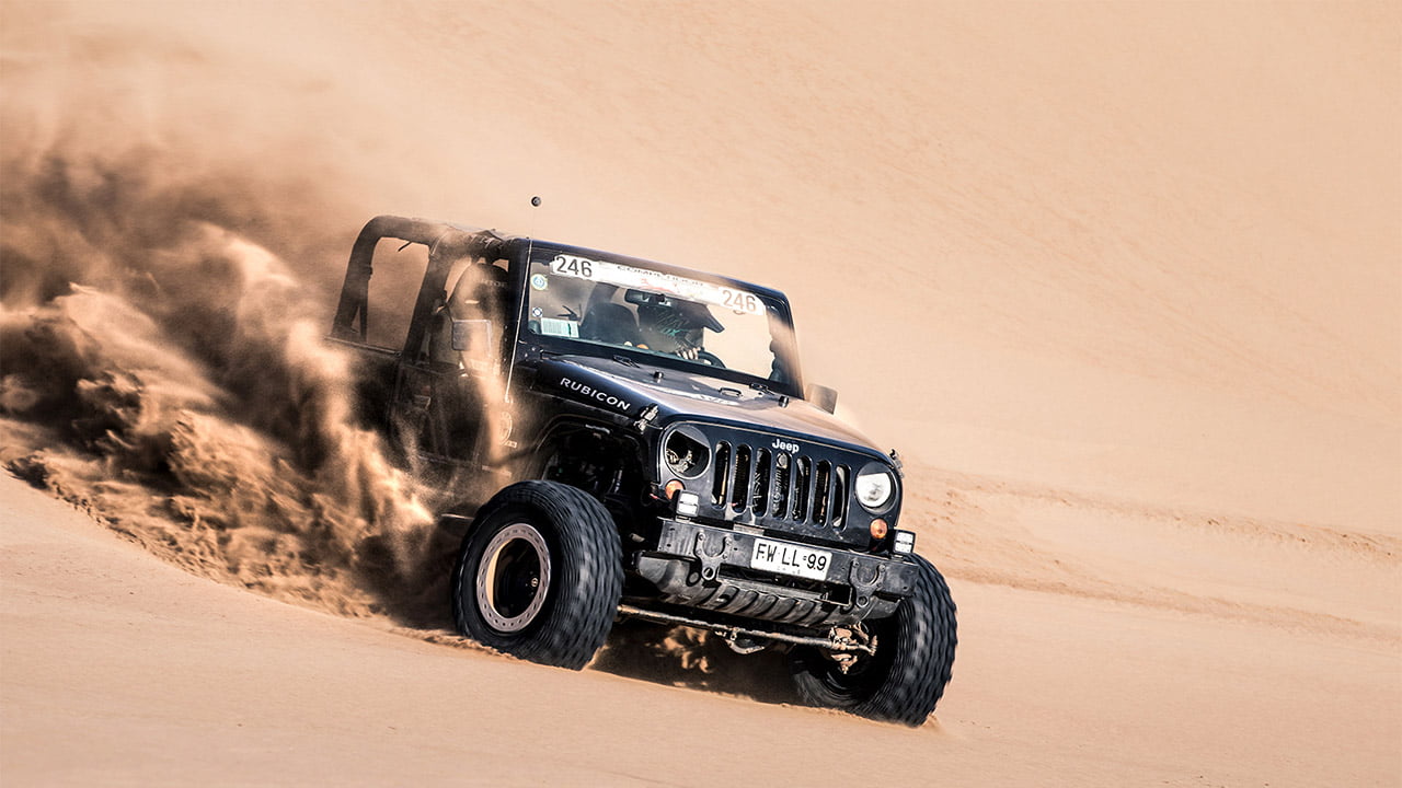 A pilot racing with the Jeep